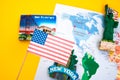 Usa flag and magnets from new york and san francisco over world map with pins Royalty Free Stock Photo