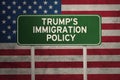 USA flag with trump policy and signpost