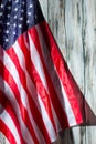 USA flag on wooden background.