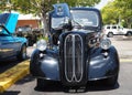 Front view of exotic antique car with kidney grills and double door engine doors