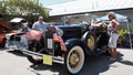 Restored 1931 Ford model A roadster in black paint with american flags attached to bumper Royalty Free Stock Photo