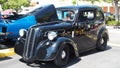 Side view of exotic antique car with kidney grills and double door engine doors