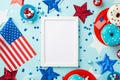 USA Independence Day concept. Top view photo of photo frame national flags stars confetti paper backing molds with candies plates