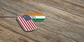 USA and India military relations, Identification tags on wooden background. 3d illustration