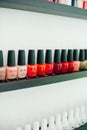 Usa, la - january, 2020 colorful nail polish colors in a row at nails saloon on white background Royalty Free Stock Photo