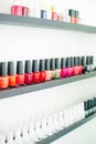 Usa, la - january, 2020 colorful nail polish colors in a row at nails saloon on white background