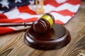 USA lawyers a US legal office with sandglass judge's gavel on American flag wooden table Royalty Free Stock Photo