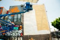 USA, Los Angeles - june 2018 Graffiti Artist Painting On The Street Wall. Man with aerosol spray bottle near the wall.