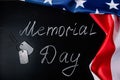 USA Memorial Day concept. American flag and dog tags on black background. Handwritten lettering on chalkboard