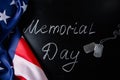 USA Memorial Day concept. American flag and dog tags on black background. Handwritten lettering on chalkboard