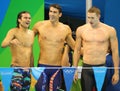 USA Men's 4x100m medley relay team Cory Miller (L), Michael Phelps and Ryan Murphy celebrate victory