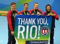 USA Men`s 4x100m medley relay team Nathan AdrianL, Michael Phelps, Ryan Murphy and Cory Miller celebrate victory at the Rio 2016