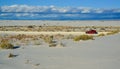 red car rides the harms of sand dunes from gypsum to White Sands National Monument