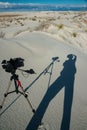 USA, NEW MEXICO - NOVEMBER 23, 2019: Shadow of a photographer on a gypsum dune in White Sands National Monument in New Mexico, USA Royalty Free Stock Photo