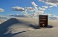 Visitor center information plate covered with gypsum sand.