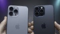 USA, New York - September 15, 2023: iPhone Design Comparison. Action. Man is holding latest versions of iPhones 14 and