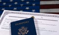 USA passport and naturalization certificate over US Flag Royalty Free Stock Photo