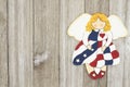 USA patriotic old flag on an angel on a weathered wood background Royalty Free Stock Photo