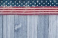 USA patriotic old flag on a weathered wood background Royalty Free Stock Photo