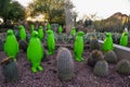 USA, PHENIX, ARIZONA- NOVEMBER 17, 2019: multi-colored plastic animal figures among cacti of different species in the botanical