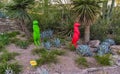 USA, PHENIX, ARIZONA- NOVEMBER 17, 2019: multi-colored plastic animal figures among cacti of different species in the botanical Royalty Free Stock Photo