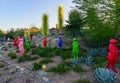 USA, PHENIX, ARIZONA- NOVEMBER 17, 2019: multi-colored plastic animal figures among cacti of different species in the botanical Royalty Free Stock Photo