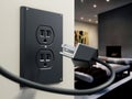 USA type AC power plug and socket on the wall. 3D illustration Royalty Free Stock Photo