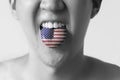 USA or United States flag painted in tongue of a man - indicating English language and American accent speaking, study in Royalty Free Stock Photo