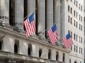 Usa flags waving in Financial District Wall Street Manhattan New York City