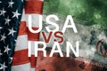 USA vs or versus IRAN - inscription over American flag and Iranian flag on grunge background. Problems and conflict with