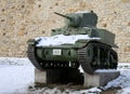 USA World War II Stuart M3A1 light tank on the pedestal in the snow in museum during the winter.