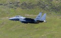 USAF F-15E Strike Eagle flying through the Mach Loop Royalty Free Stock Photo