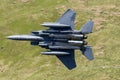 USAF F-15E Strike Eagle flying through the Mach Loop Royalty Free Stock Photo