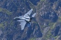 USAF F-15E Strike Eagle flying through the Mach Loop Royalty Free Stock Photo