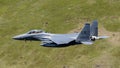 USAF F-15E Strike Eagle flying through the Mach Loop Royalty Free Stock Photo