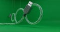 USB Cable Connecting to Circuit Board Over Green Background, Technology and Data Transfer Concept Royalty Free Stock Photo