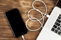 A USB cable connects your phone and laptop Royalty Free Stock Photo