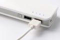 USB cable with USB wall charger plug on a white background. Portable charger close-up Royalty Free Stock Photo