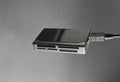 USB card reader on a gray background. Royalty Free Stock Photo