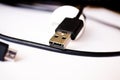 USB cord. USB the wire. Cord for charging the phone. output. Black cord Phone cable. Royalty Free Stock Photo