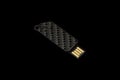 USB dark flash drive on black isolated background