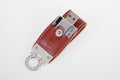 USB devices key flash drive for data storage made of leather and metal on white background Royalty Free Stock Photo
