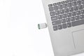 USB flash drive inserted into a laptop on a white background. Modern digital media Royalty Free Stock Photo