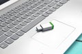 USB flash drive on the laptop keyboard. Modern media technologies Royalty Free Stock Photo