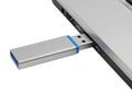 A usb flash drive securely inserted into a laptop\'s usb port for data transfer Royalty Free Stock Photo