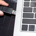 USB flash memory drive plugged into a computer laptop port. Royalty Free Stock Photo