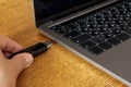 Usb a flash memory stick connecting to usb c laptop port.