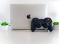 USB Gamepad Controller Attached to Apple Macbook Pro Laptop Concept