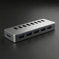 A USB hub with metal casing on a dark surface. It has multiple USB 3.0 ports Royalty Free Stock Photo