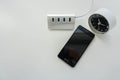 USB hub for smartphone battery charge with rounded modern clock Royalty Free Stock Photo